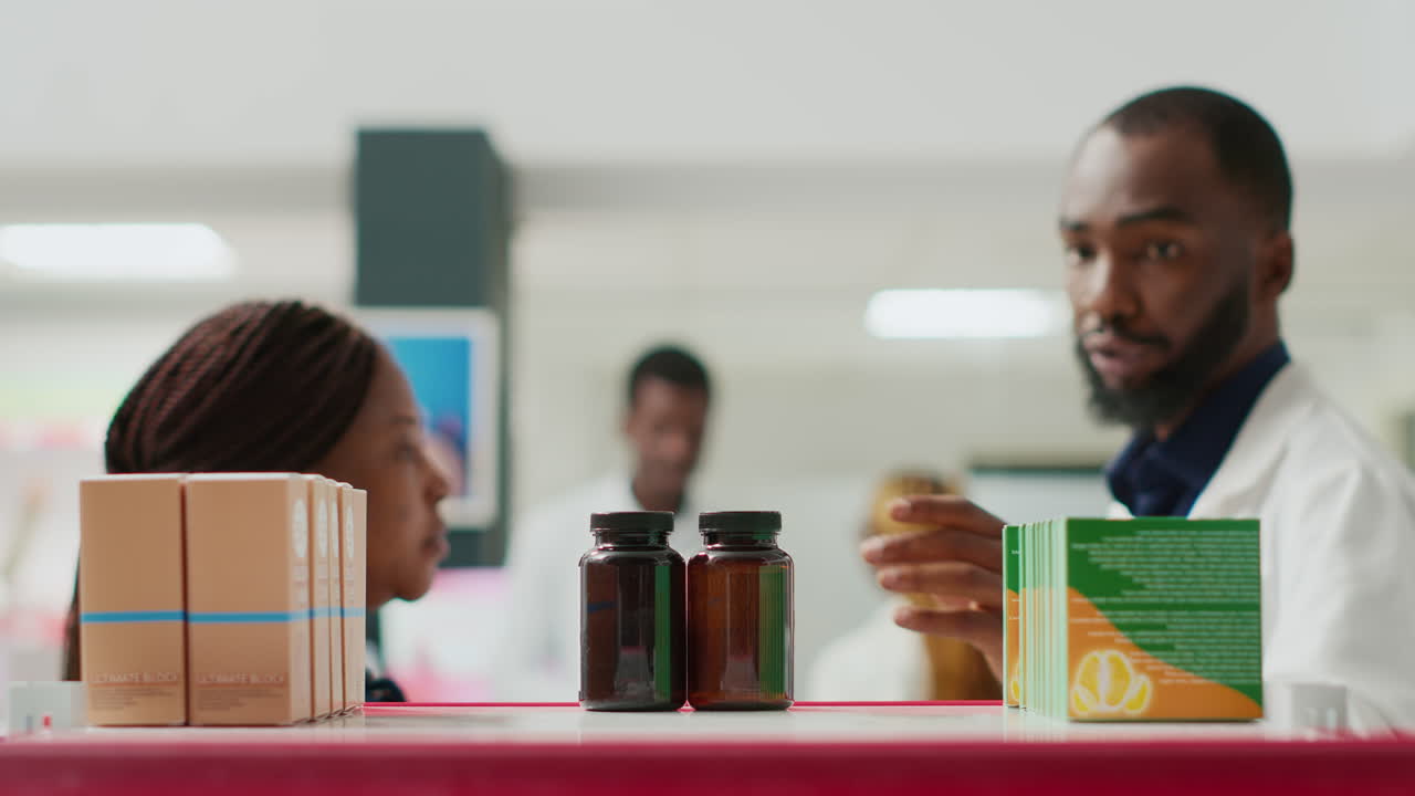 Pharmacist assisting customer at pharmacy counter