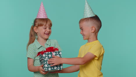 Happy-little-toddler-boy-presenting-birthday-gift-box,-present-to-lovely-girl-kid-sibling-or-friend