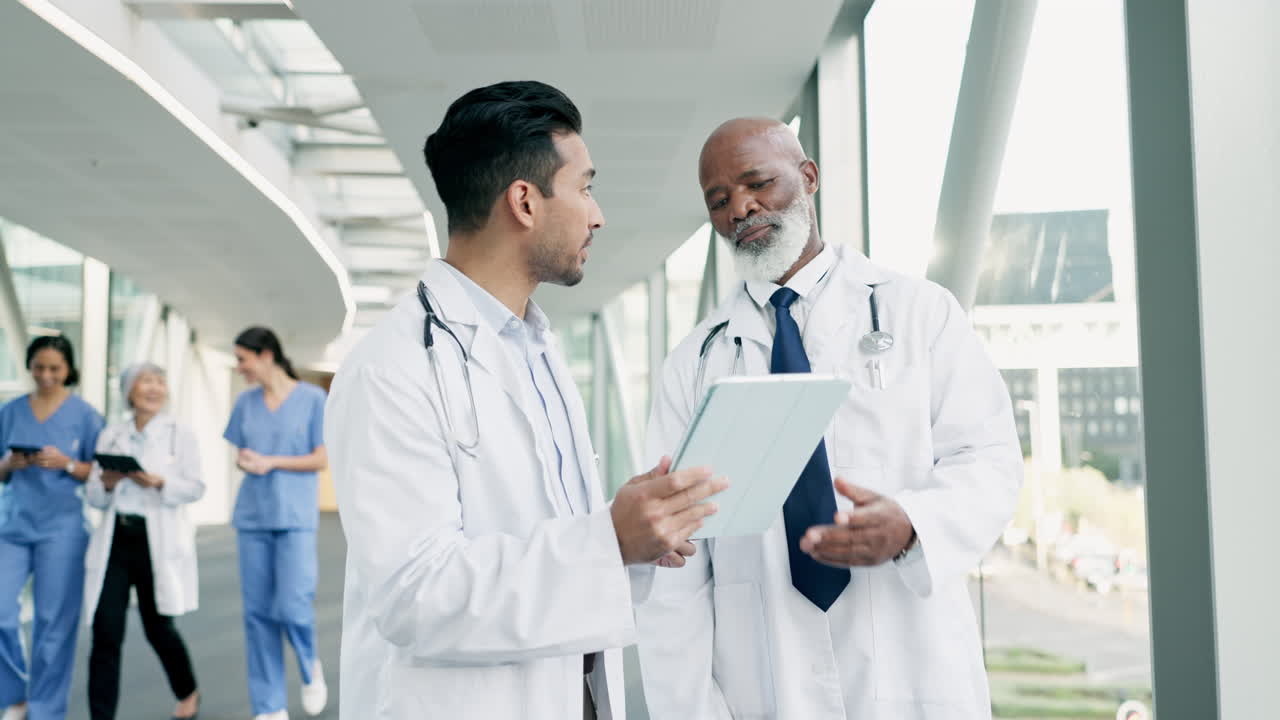 Doctor, tablet and conversation in hospital