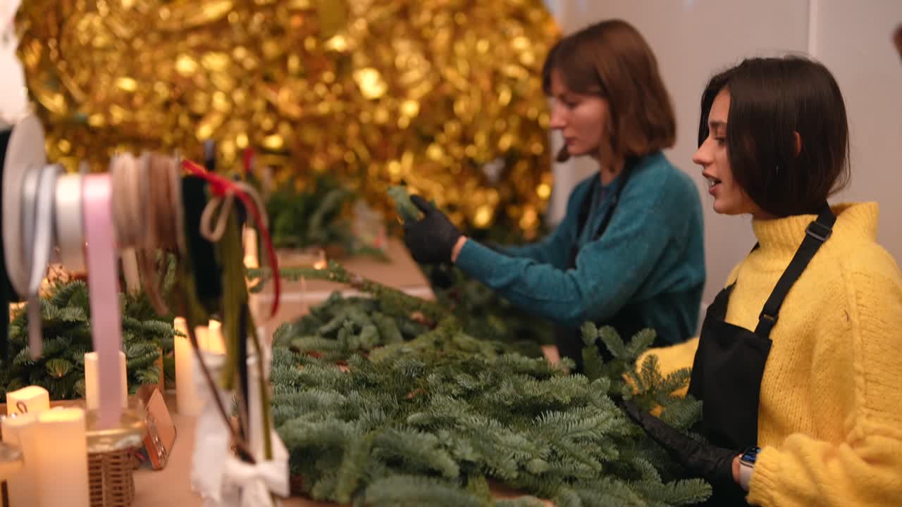 People making Christmas wreaths