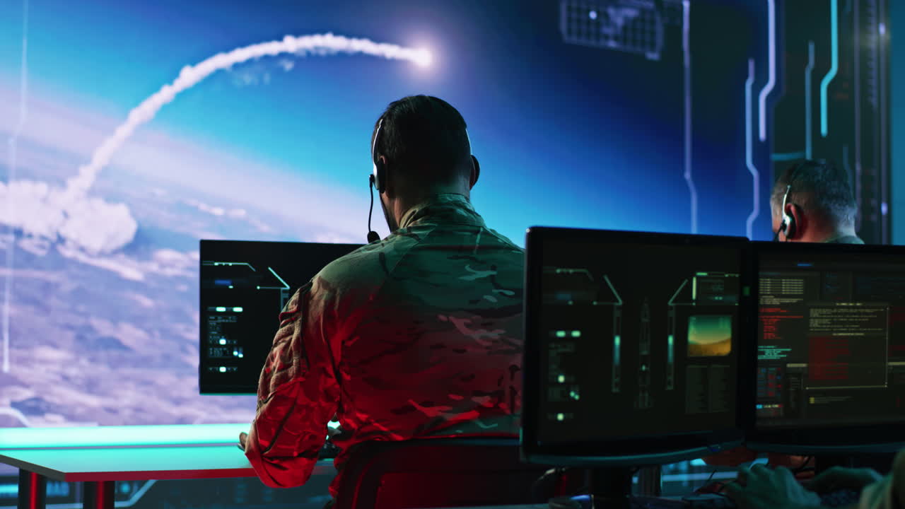 Military personnel in a mission control center