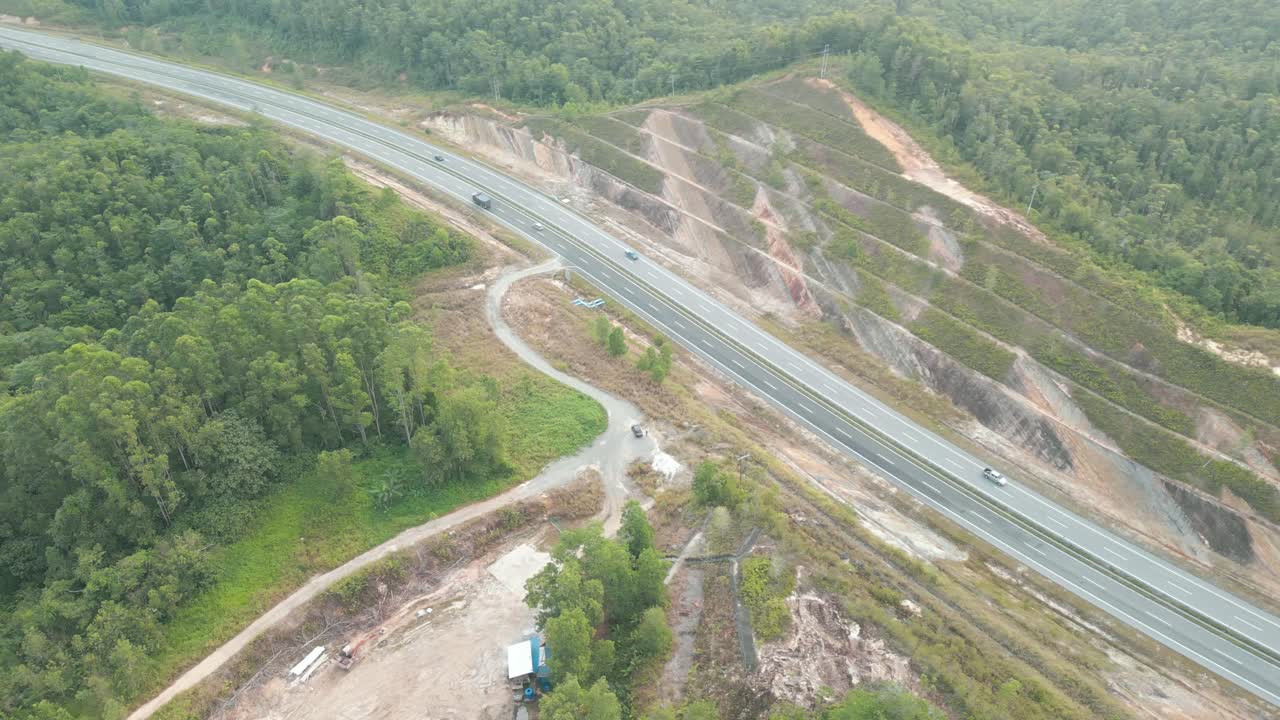 Beautiful Drone View Of Bau To Lundu Pan Borneo Highway During Morning Sunset With Mountain And Valley, Green Forest,Sarawak, Borneo.
