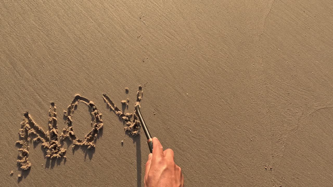 &amp;quot;No War&amp;quot; word is written on the sandy beach