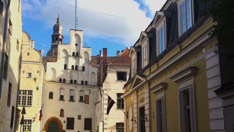 A-shot-focus-on-the-Three-Brothers-houses-at-the-bottom-of-a-street-in-Riga,-Latvia