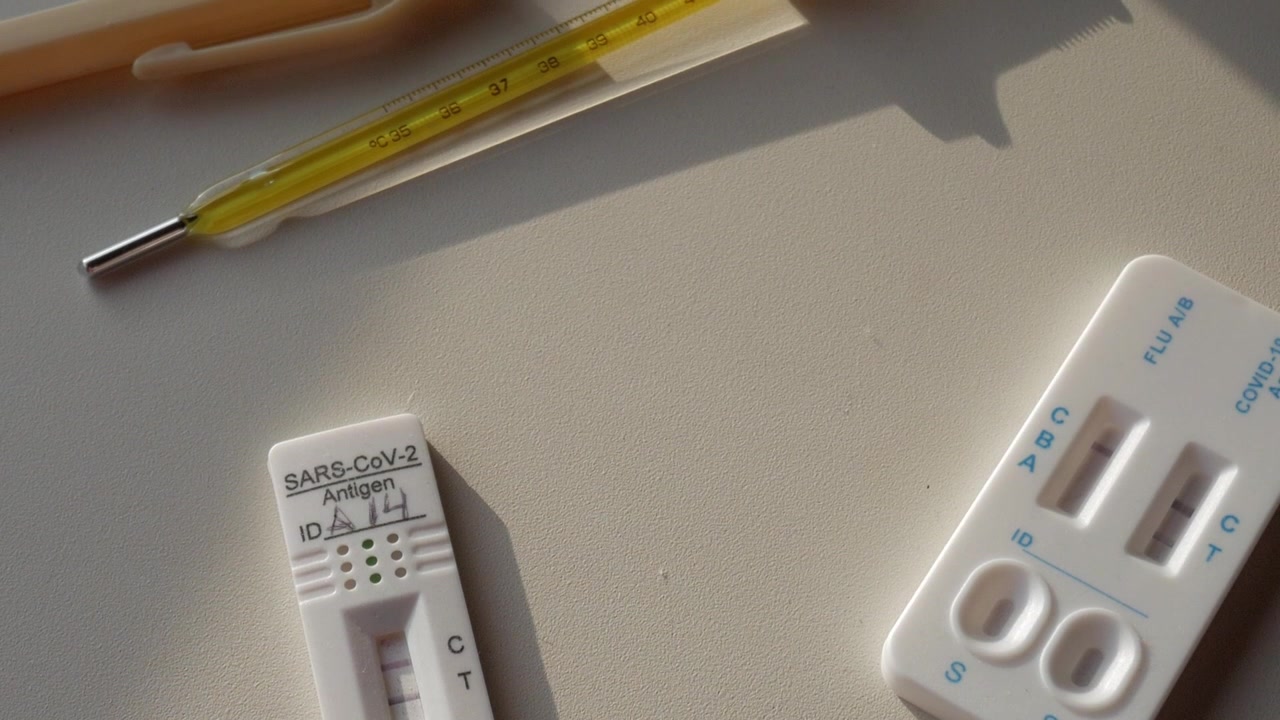 Forward view of several Covid tests on a table. Slow motion