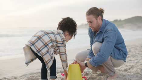 Family,-father-and-child-with-sand-castle-at-beach