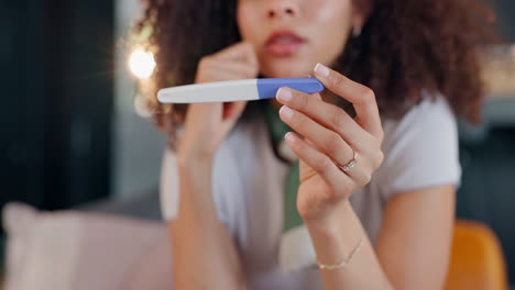 woman holding a pregnancy test