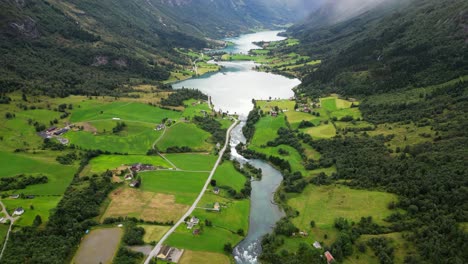 olden river to oldevatnet in norway - green valley nature landscape in nordfjord, vestland, norway, scandinavia - aerial