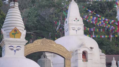 small stupa around swayambhunath stupa stands on the hill in kathmandu, nepal - monkey temple - panning shot