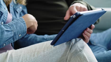 close up of couple using a tablet