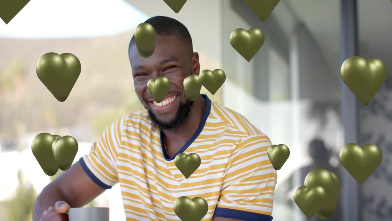 Man holding mug touching beard on patio, green hearts appearing and sparking smiles for social ad