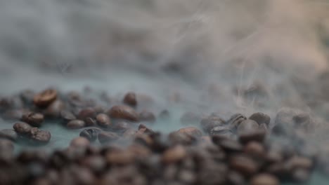 macro of a smoke rises above the coffee bean