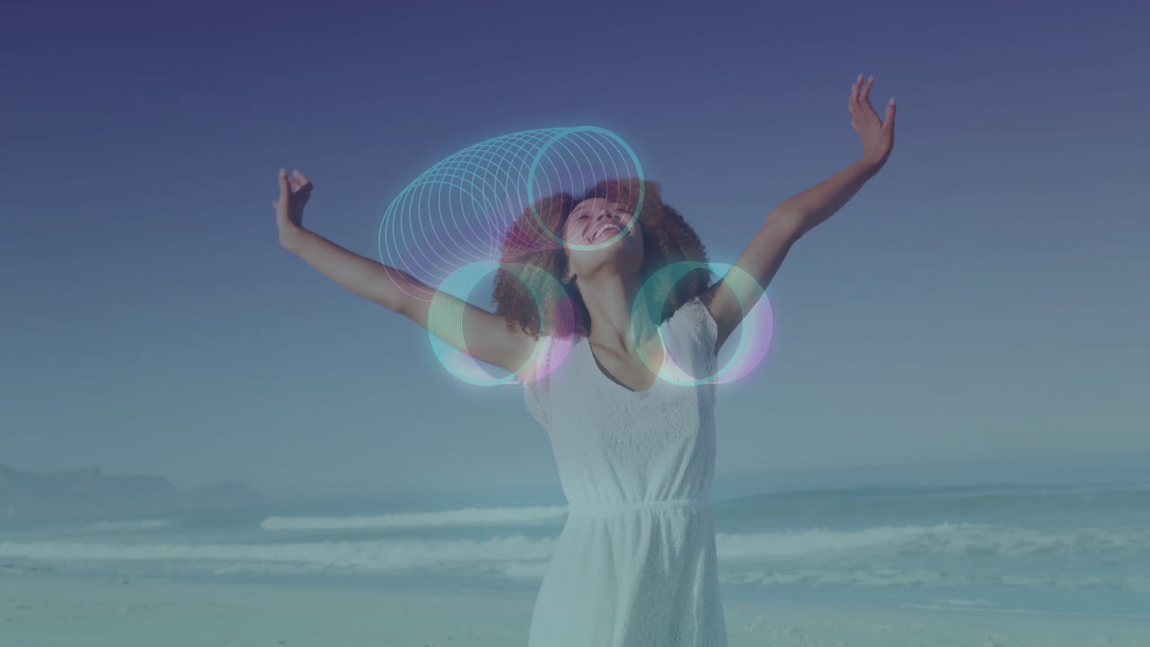 Woman enjoying beach with glowing circles animation over her arms