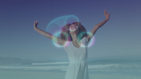 woman enjoying beach with glowing circles animation over her arms