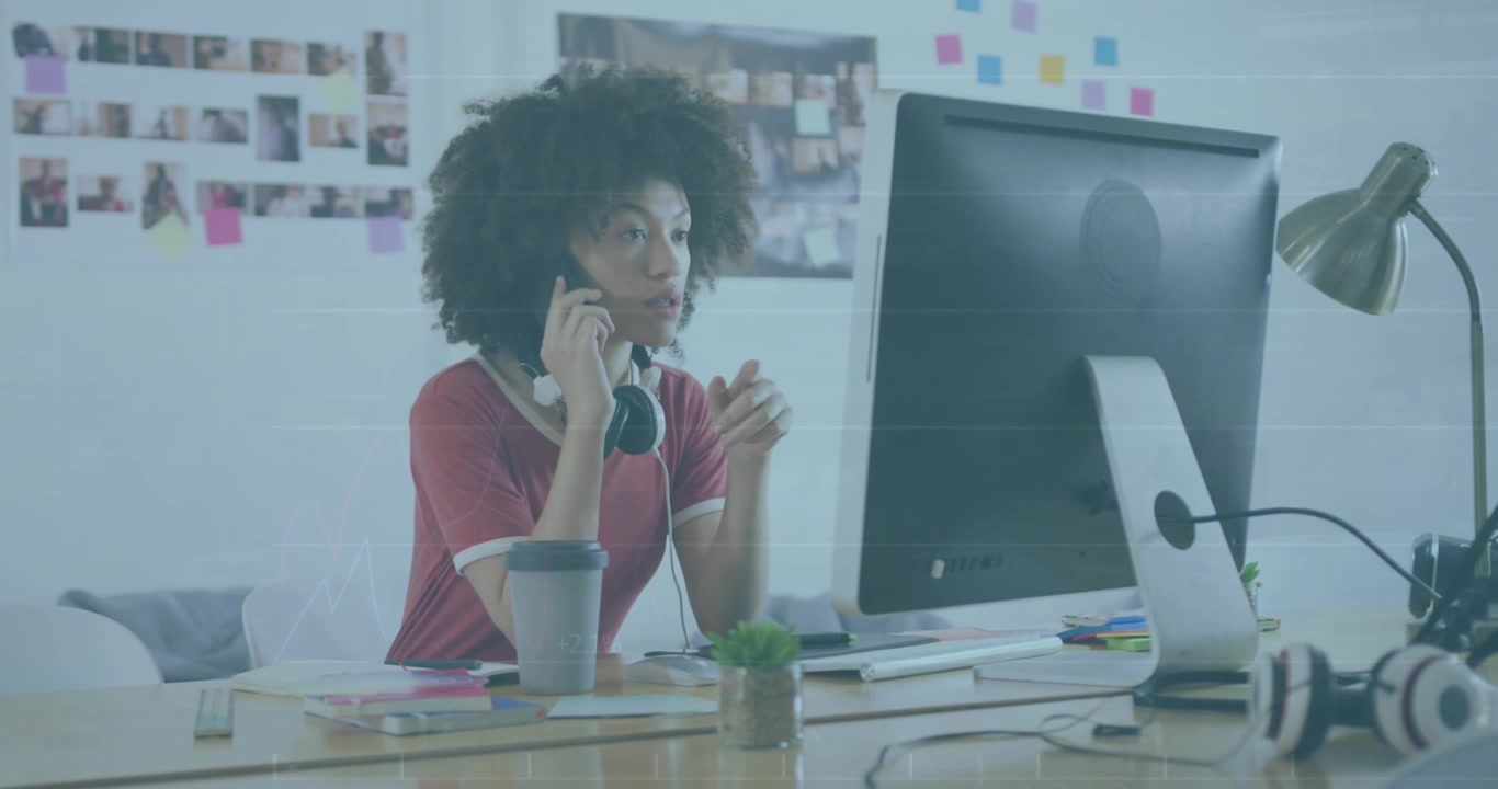 Animation of financial data processing over businesswoman using computer