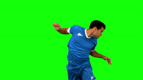 man heading a football on green screen