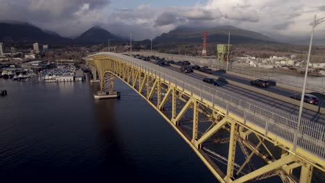 Drone-flying-along-Ironworkers-Memorial-Bridge-on-Burrard-Inlet-in-Vancouver,-British-Columbia,-Canada