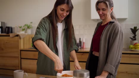 two women cooking together