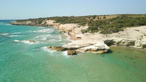 Aerial-View-Of-Rocky-Coastline-Of-Kos-Beach-In-Daytime-In-Greece