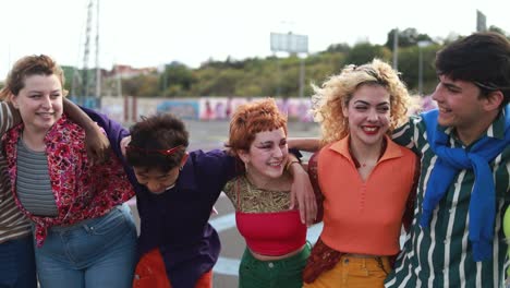 young diverse people having fun outdoor laughing together