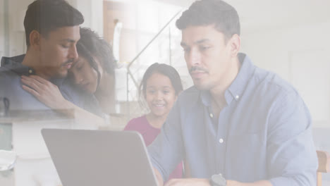 Composite-of-sad-parents-embracing,-and-happy-father-and-daughter-looking-at-laptop-together