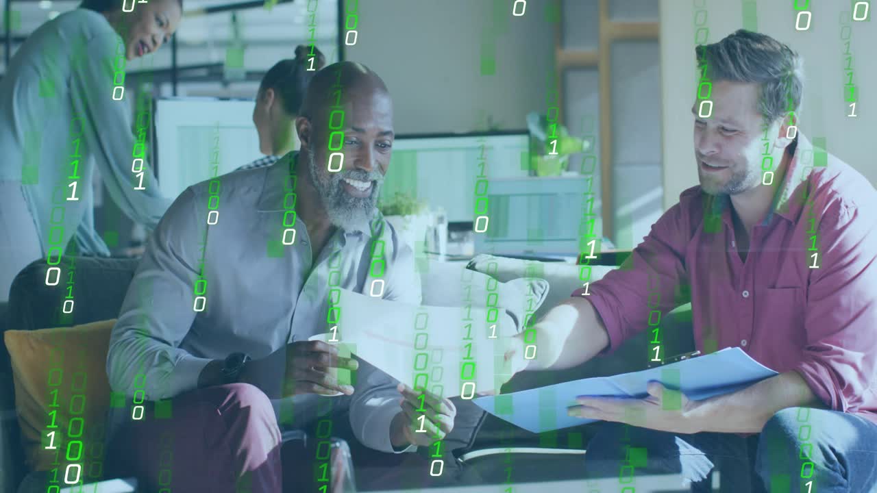 Men exchanging documents in office lounge collaborating on tech project while binary code flowing