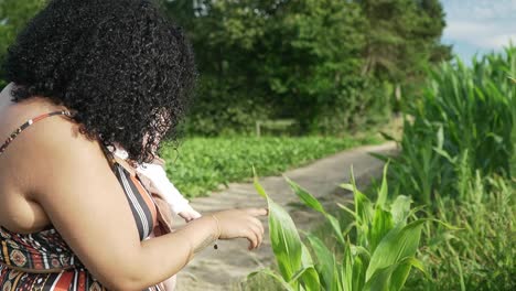 mother and baby enjoying their day out in the farm fields of sunny belgium.