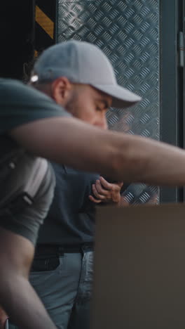 delivery workers managing logistics with a tablet