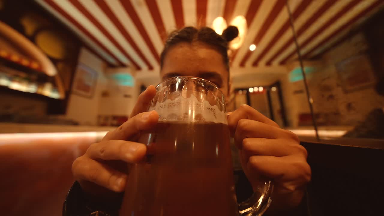 Woman Holding a Mug of Beer