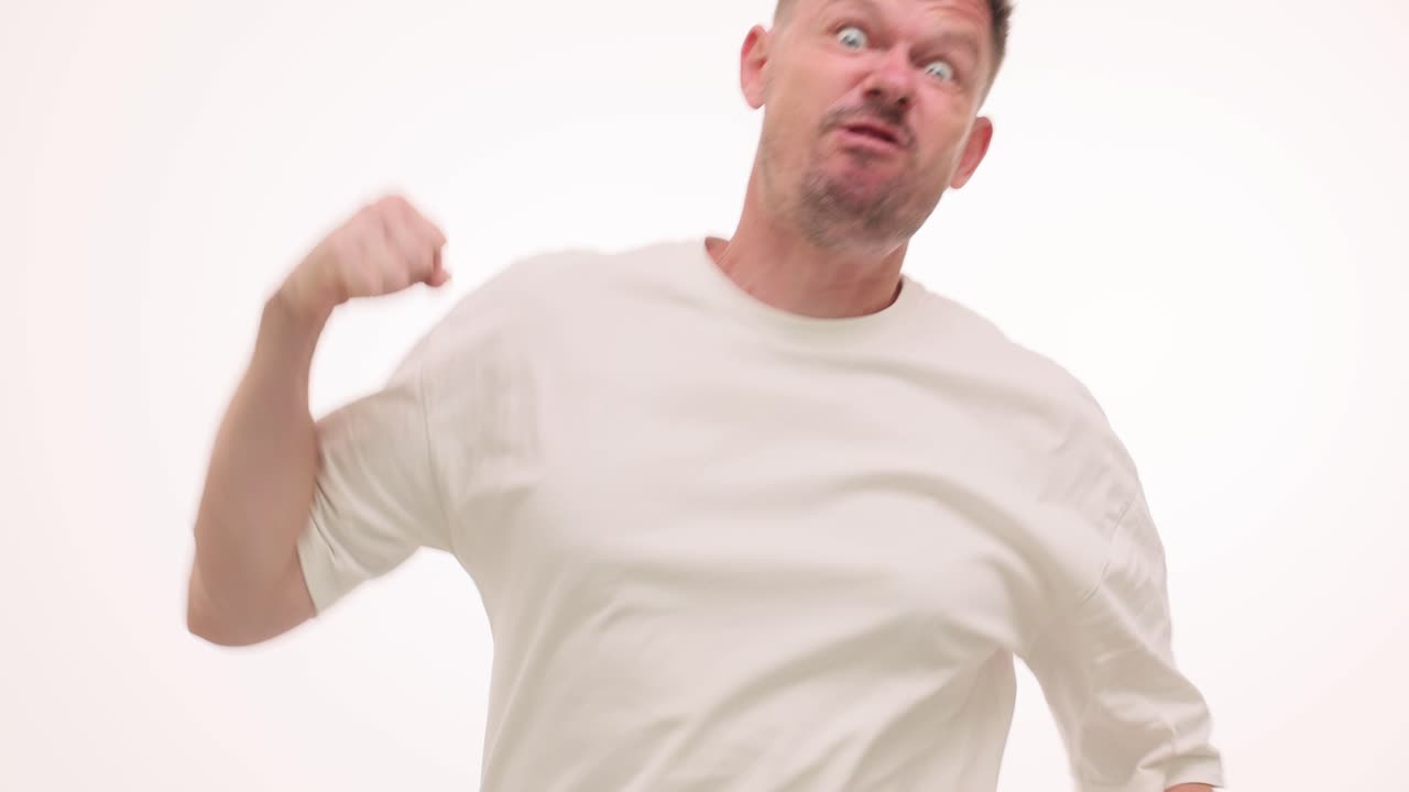 Man expressing anger and frustration with aggressive gestures