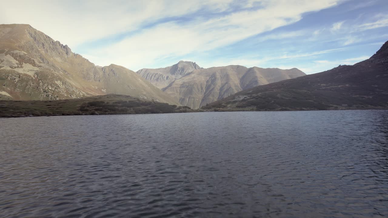 Aerial beautiful calming clear water lake in mountain alps summer sunny landscape, K&uuml;htai, Austria