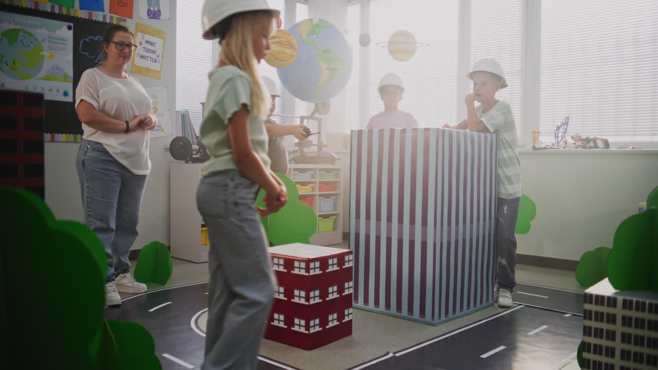 Smart Kids in Hardhats Discussing Urban Planning Elementary School Boy Giving Instructions