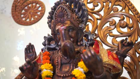 ganpati statue of indian god dark stone slow motion