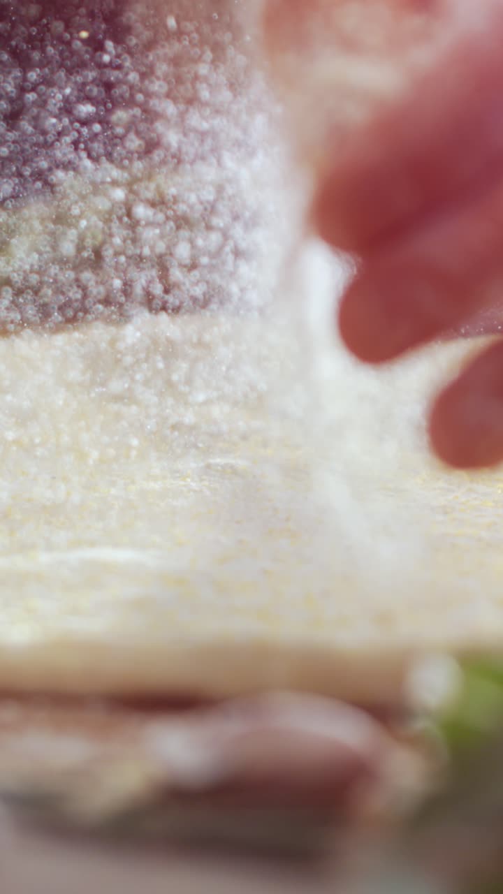 Close-up of Flour Being Sprinkled on Dough