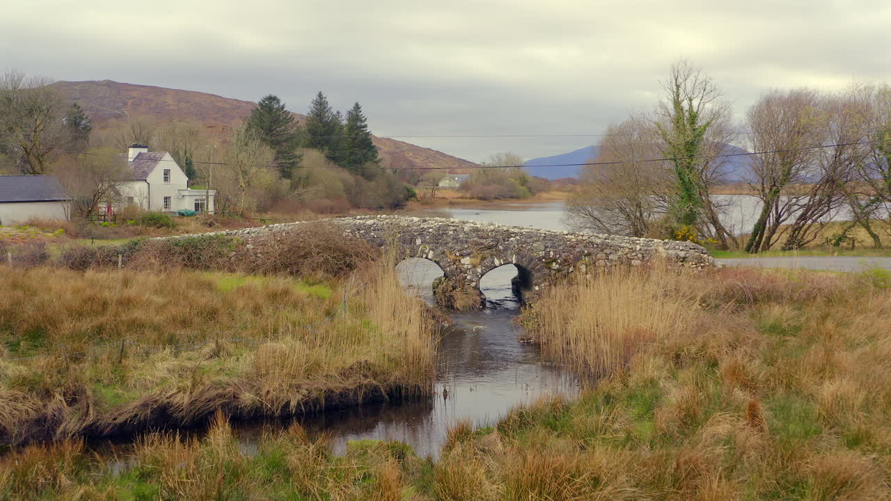 Aerial drone footage flying over the Quiet Man Bridge, Connemara, Ireland