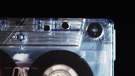 closeup of tape playing inside cassette, isolated