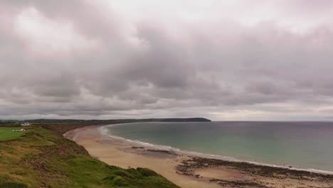 Stormy-skies-at-Hell`s-Mouth-over-the-sandy-beach-with-breaking-waves-on-the-shore