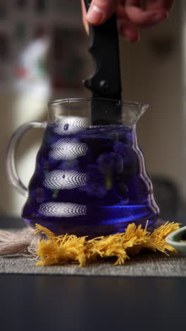 blue butterfly pea flower tea in a glass pitcher