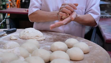 chef preparing dough for buns