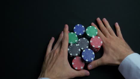 poker chips in hands