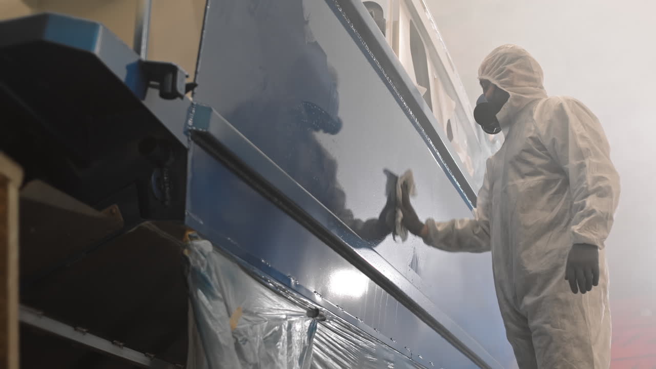 Workman Wiping New Boat Hull