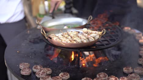 grilled squid on skewers in a frying pan.