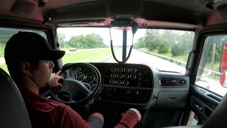 long distance trucker hauls load down interstate highway