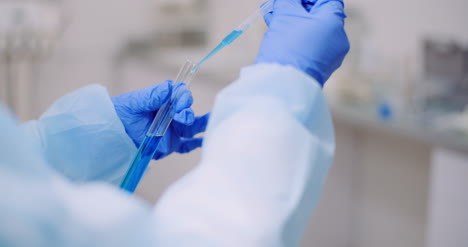 Portrait-Of-Female-Scientist-Analyzing-With-A-Pipette-At-Laboratory-2