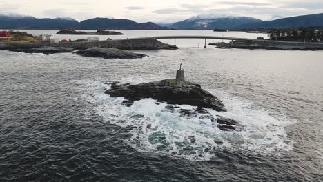 waves crashing on rocky island near the famous atlantic ocean road in norway