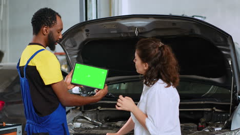 Mechanic-and-client-with-mockup-laptop