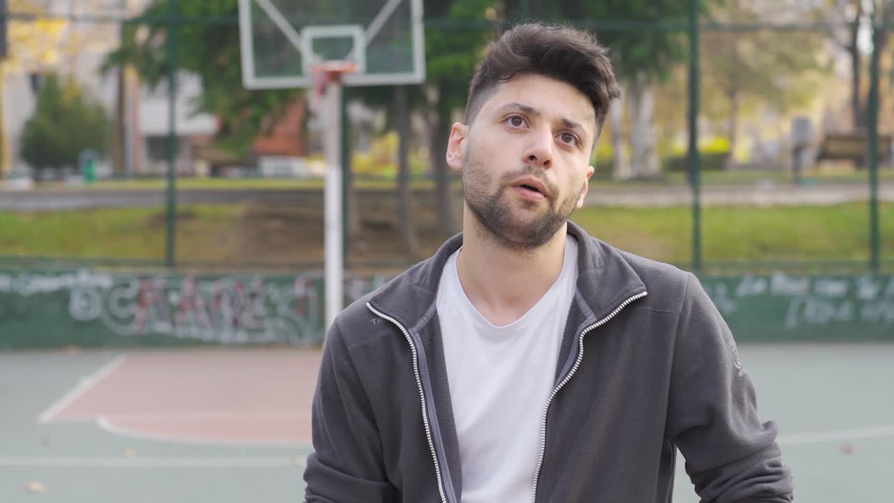 The unhappy man can't score a basket. Fail.