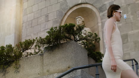 distant view of elegant woman in sunglases