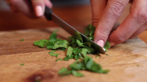 white chef chopping corriander her