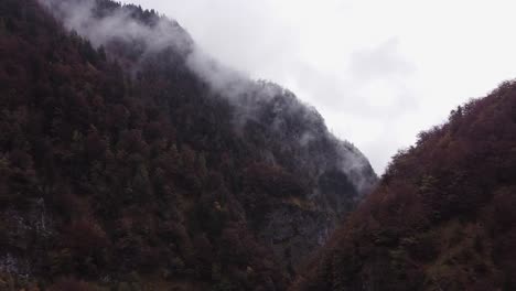 Epic-cinematic-aerial-scenery-of-steep-mountain-hill-in-fall